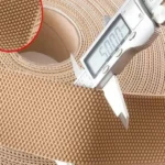 Dộ dày nhám quấn trục con lăn máy trải vải